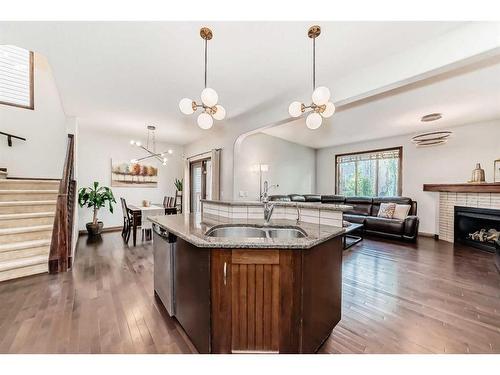 41 Everbrook Drive Sw, Calgary, AB - Indoor Photo Showing Kitchen With Fireplace With Double Sink