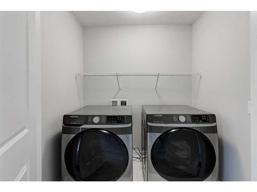 113 Howse Common Ne, Calgary, AB - Indoor Photo Showing Laundry Room