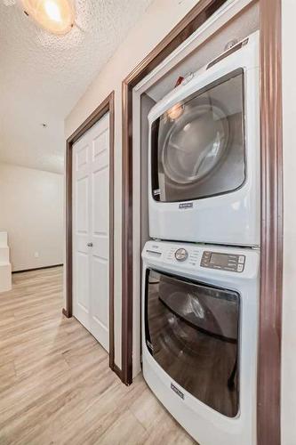 2304-10 Prestwick Bay Se, Calgary, AB - Indoor Photo Showing Laundry Room