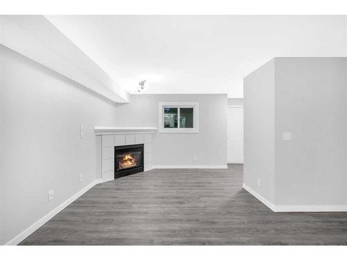 102-1728 34 Street Se, Calgary, AB - Indoor With Fireplace