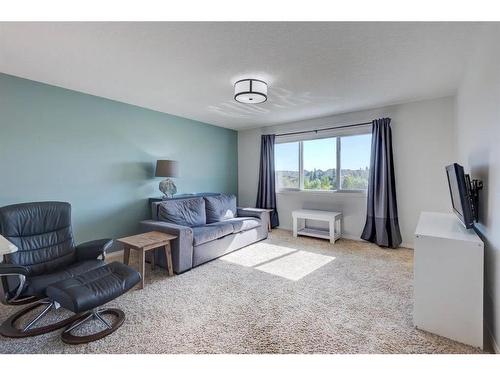 36 Auburn Springs Cove Se, Calgary, AB - Indoor Photo Showing Living Room