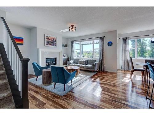 36 Auburn Springs Cove Se, Calgary, AB - Indoor Photo Showing Living Room With Fireplace