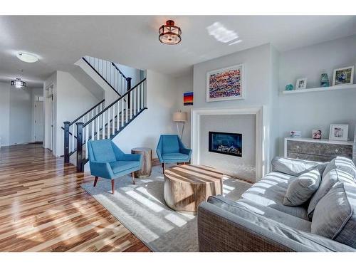 36 Auburn Springs Cove Se, Calgary, AB - Indoor Photo Showing Living Room With Fireplace