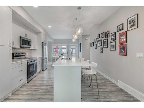 1865 Na'A Drive Sw, Calgary, AB - Indoor Photo Showing Kitchen With Double Sink