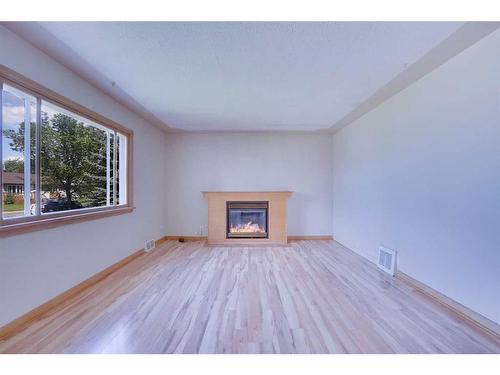 2021 21 Avenue Nw, Calgary, AB - Indoor Photo Showing Living Room With Fireplace