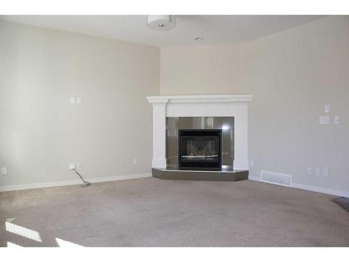 1217 Brightoncrest Common Se, Calgary, AB - Indoor Photo Showing Living Room With Fireplace