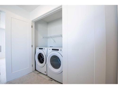 811 Carrington Boulevard Nw, Calgary, AB - Indoor Photo Showing Laundry Room