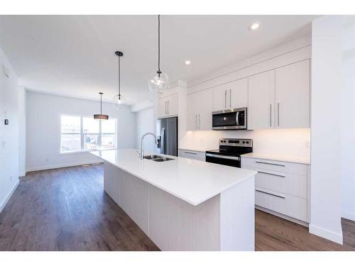 811 Carrington Boulevard Nw, Calgary, AB - Indoor Photo Showing Kitchen With Double Sink With Upgraded Kitchen