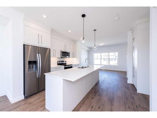 811 Carrington Boulevard Nw, Calgary, AB - Indoor Photo Showing Kitchen With Double Sink With Upgraded Kitchen