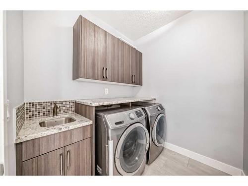 66 Heston Street Nw, Calgary, AB - Indoor Photo Showing Laundry Room