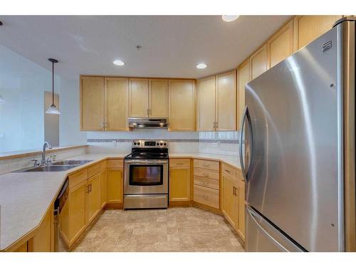 404-1718 14 Avenue Nw, Calgary, AB - Indoor Photo Showing Kitchen With Stainless Steel Kitchen With Double Sink