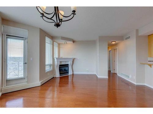 404-1718 14 Avenue Nw, Calgary, AB - Indoor Photo Showing Living Room With Fireplace