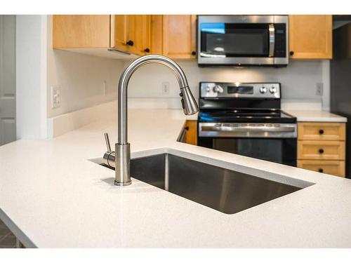 428-345 Rocky Vista Park Nw, Calgary, AB - Indoor Photo Showing Kitchen With Double Sink