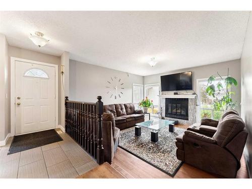 16 Whiteram Mews Ne, Calgary, AB - Indoor Photo Showing Living Room With Fireplace