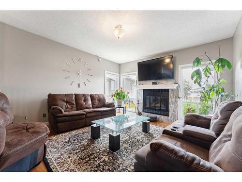 16 Whiteram Mews Ne, Calgary, AB - Indoor Photo Showing Living Room With Fireplace