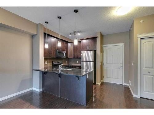 2405-175 Panatella Hill Nw, Calgary, AB - Indoor Photo Showing Kitchen With Stainless Steel Kitchen