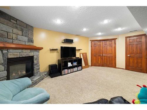 115 Chapala Drive Se, Calgary, AB - Indoor With Fireplace