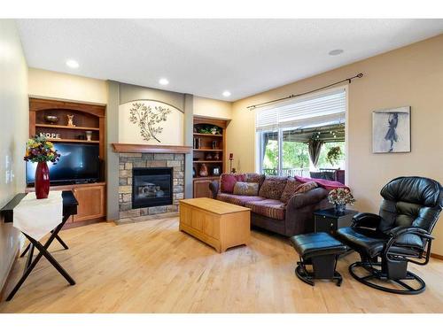 115 Chapala Drive Se, Calgary, AB - Indoor Photo Showing Living Room With Fireplace