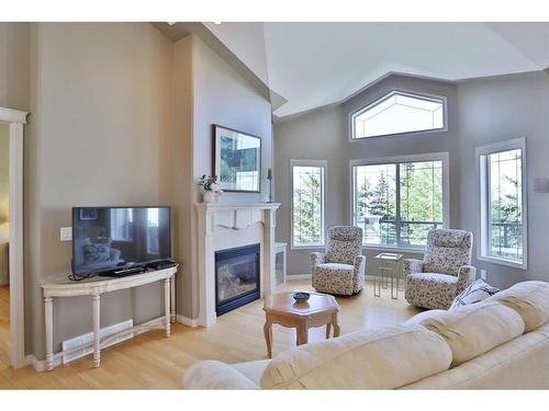421 Rocky Vista Gardens Nw, Calgary, AB - Indoor Photo Showing Living Room With Fireplace