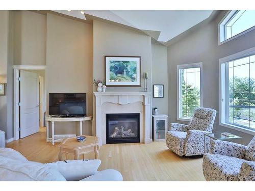 421 Rocky Vista Gardens Nw, Calgary, AB - Indoor Photo Showing Living Room With Fireplace