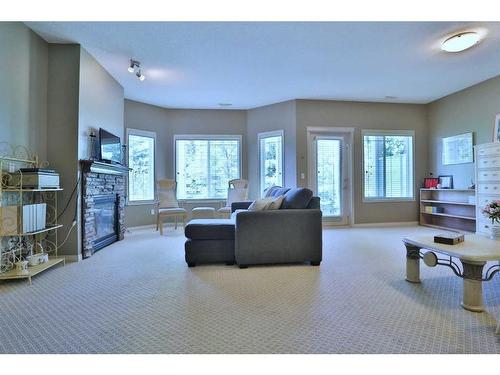 421 Rocky Vista Gardens Nw, Calgary, AB - Indoor Photo Showing Living Room With Fireplace