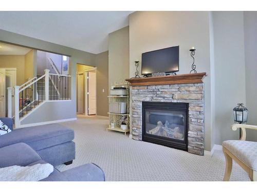 421 Rocky Vista Gardens Nw, Calgary, AB - Indoor Photo Showing Living Room With Fireplace