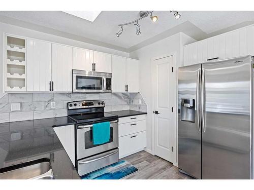 80 Douglas Ridge Circle Se, Calgary, AB - Indoor Photo Showing Kitchen With Stainless Steel Kitchen With Upgraded Kitchen