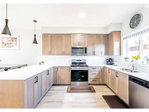 147 Corner Meadows Grove, Calgary, AB - Indoor Photo Showing Kitchen With Stainless Steel Kitchen With Double Sink