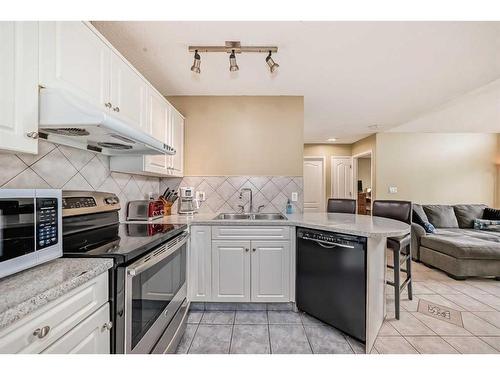 411-20 Sierra Morena Mews Sw, Calgary, AB - Indoor Photo Showing Kitchen With Double Sink