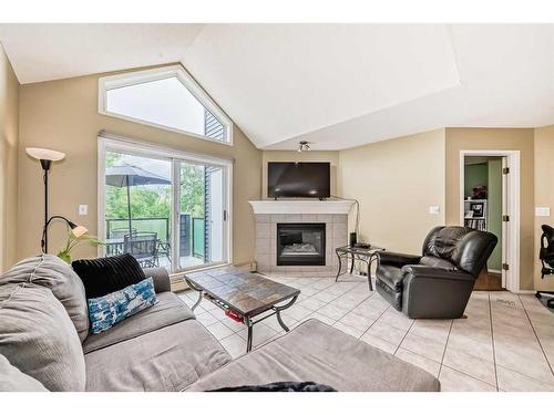 411-20 Sierra Morena Mews Sw, Calgary, AB - Indoor Photo Showing Living Room With Fireplace
