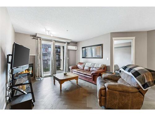 2313-175 Panatella Hill Nw, Calgary, AB - Indoor Photo Showing Living Room