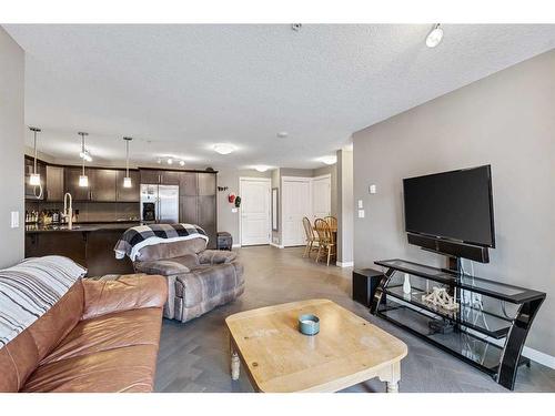 2313-175 Panatella Hill Nw, Calgary, AB - Indoor Photo Showing Living Room