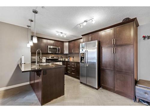 2313-175 Panatella Hill Nw, Calgary, AB - Indoor Photo Showing Kitchen With Upgraded Kitchen