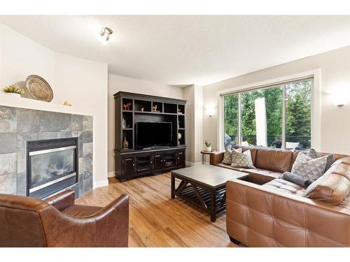 71 Discovery Ridge Mount Sw, Calgary, AB - Indoor Photo Showing Living Room With Fireplace