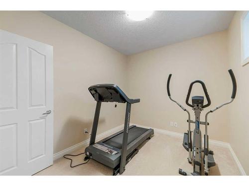 22 Discovery Woods Villas Sw, Calgary, AB - Indoor Photo Showing Gym Room