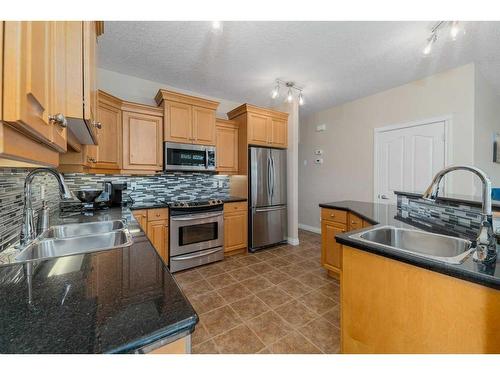 22 Discovery Woods Villas Sw, Calgary, AB - Indoor Photo Showing Kitchen With Double Sink