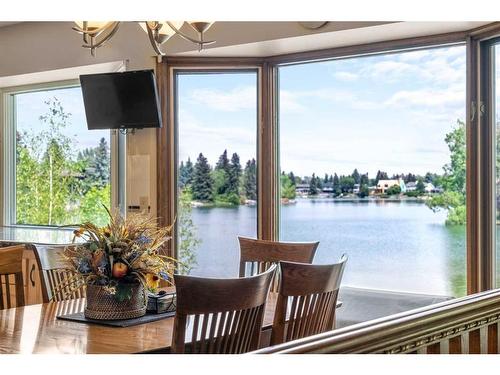 532 Lake Moraine Green Se, Calgary, AB -  Photo Showing Dining Room With Body Of Water