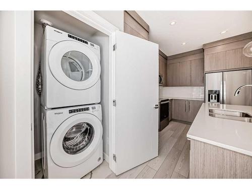 2107-681 Savanna Boulevard Ne, Calgary, AB - Indoor Photo Showing Laundry Room