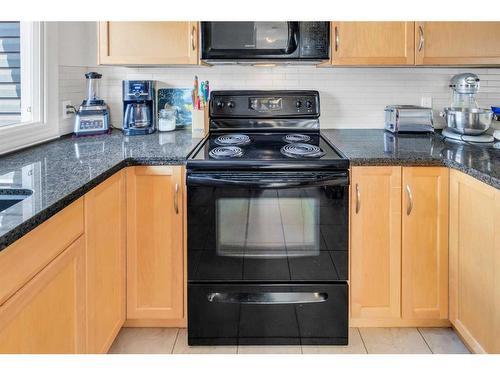 262-76 Glamis Green Sw, Calgary, AB - Indoor Photo Showing Kitchen With Double Sink