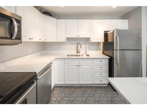 310-545 18 Avenue Sw, Calgary, AB - Indoor Photo Showing Kitchen With Stainless Steel Kitchen With Double Sink