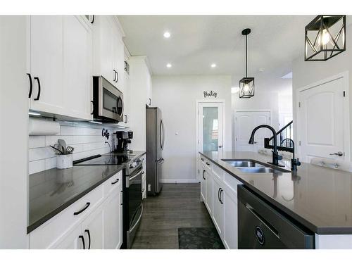 36 Drake Landing Gardens, Okotoks, AB - Indoor Photo Showing Kitchen With Double Sink With Upgraded Kitchen