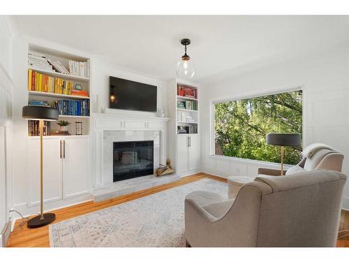 1201 Premier Way Sw, Calgary, AB - Indoor Photo Showing Living Room With Fireplace