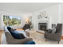 1201 Premier Way Sw, Calgary, AB  - Indoor Photo Showing Living Room With Fireplace 