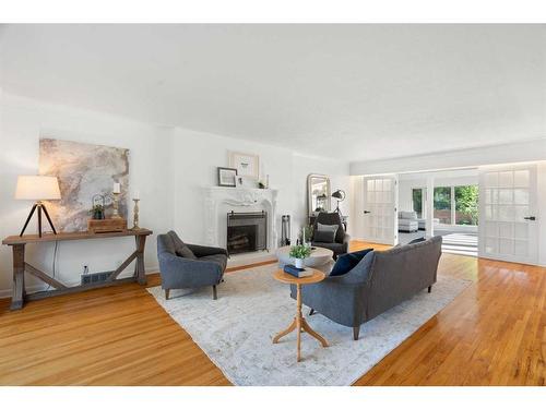 1201 Premier Way Sw, Calgary, AB - Indoor Photo Showing Living Room With Fireplace