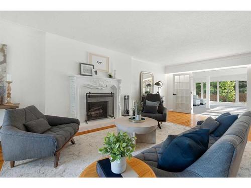 1201 Premier Way Sw, Calgary, AB - Indoor Photo Showing Living Room With Fireplace