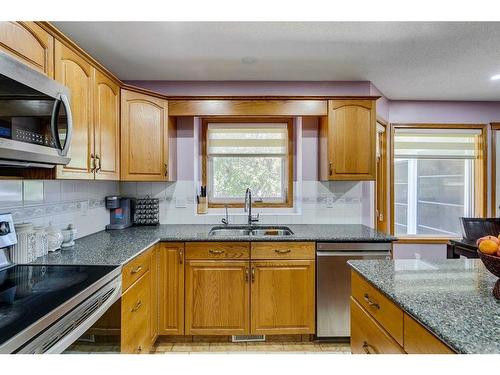 281 Westchester Green, Chestermere, AB - Indoor Photo Showing Kitchen With Double Sink