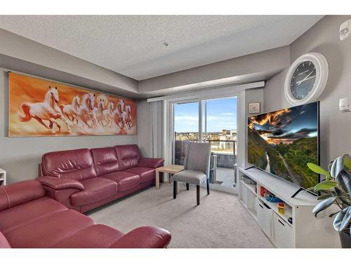 1310-4641 128 Avenue Ne, Calgary, AB - Indoor Photo Showing Living Room