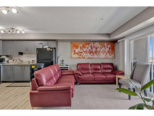 1310-4641 128 Avenue Ne, Calgary, AB - Indoor Photo Showing Living Room