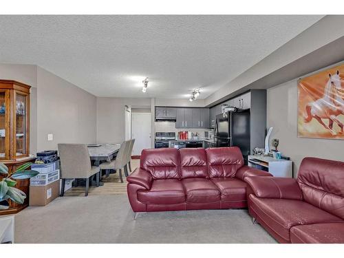 1310-4641 128 Avenue Ne, Calgary, AB - Indoor Photo Showing Living Room