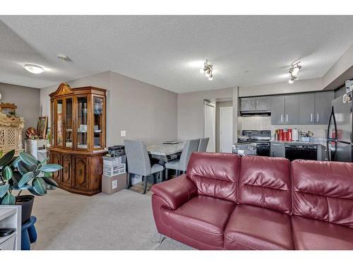 1310-4641 128 Avenue Ne, Calgary, AB - Indoor Photo Showing Living Room